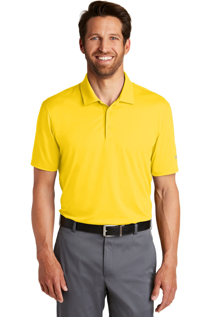 Front View of Tour Yellow Nike Dri-FIT Legacy Polo. 883681